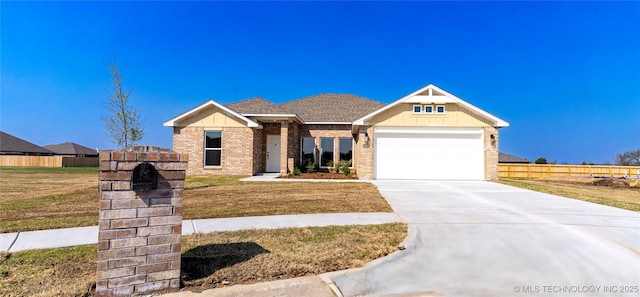 14946 S Poplar St, Glenpool, OK 74033 - view of front facade featuring brick siding, a garage, concrete driveway, and board and batten siding