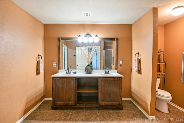 15610 E 91st St, Owasso, OK 74055 - bathroom featuring double vanity and tile patterned flooring