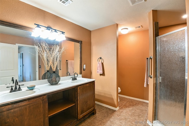 15610 E 91st St, Owasso, OK 74055 - bathroom featuring double vanity, tile patterned flooring, and a shower stall