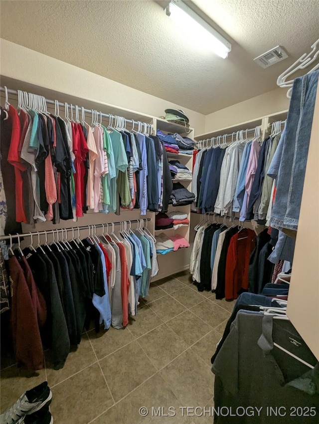15610 E 91st St, Owasso, OK 74055 - walk in closet featuring tile patterned floors