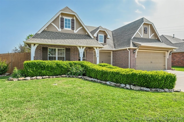 15610 E 91st St, Owasso, OK 74055 - view of front of house featuring an attached garage, brick siding, and a shingled roof