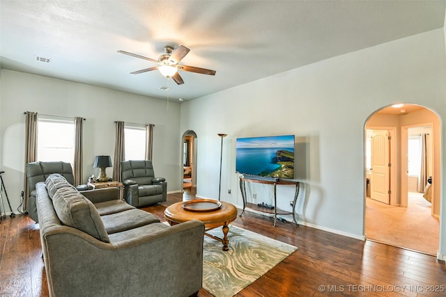 15610 E 91st St, Owasso, OK 74055 - living area featuring arched walkways, a ceiling fan, and hardwood / wood-style floors