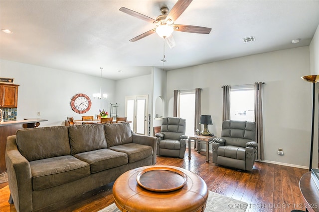 15610 E 91st St, Owasso, OK 74055 - living area with plenty of natural light, dark wood-type flooring, ceiling fan, and a chandelier