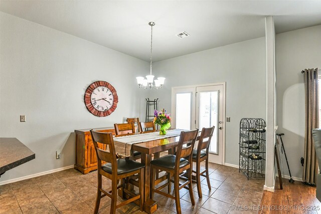 15610 E 91st St, Owasso, OK 74055 - dining room with a chandelier and dark tile patterned flooring