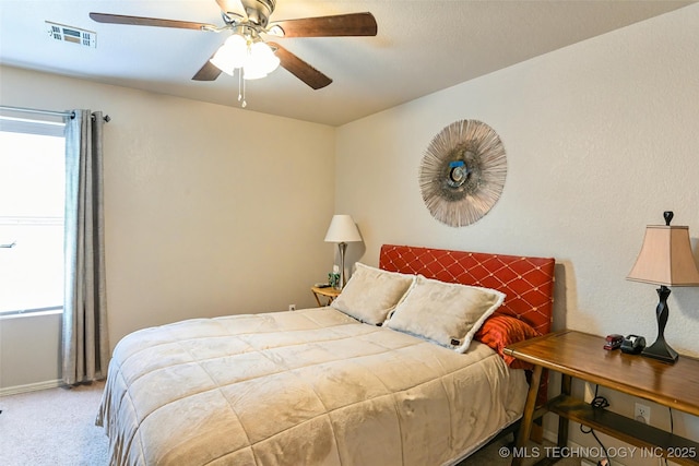 15610 E 91st St, Owasso, OK 74055 - carpeted bedroom featuring a ceiling fan and baseboards