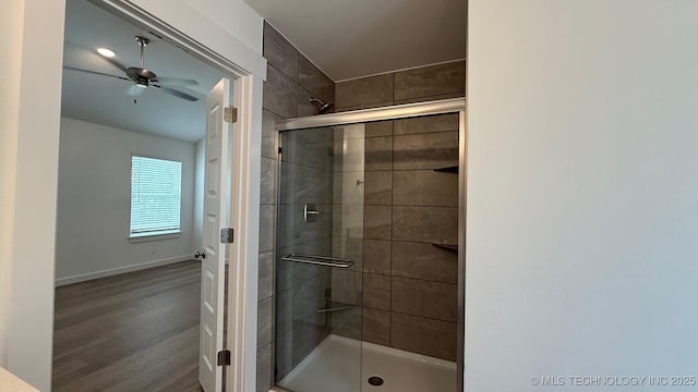 14984 S Oak St, Glenpool, OK 74033 - bathroom with a stall shower, wood finished floors, a ceiling fan, and baseboards