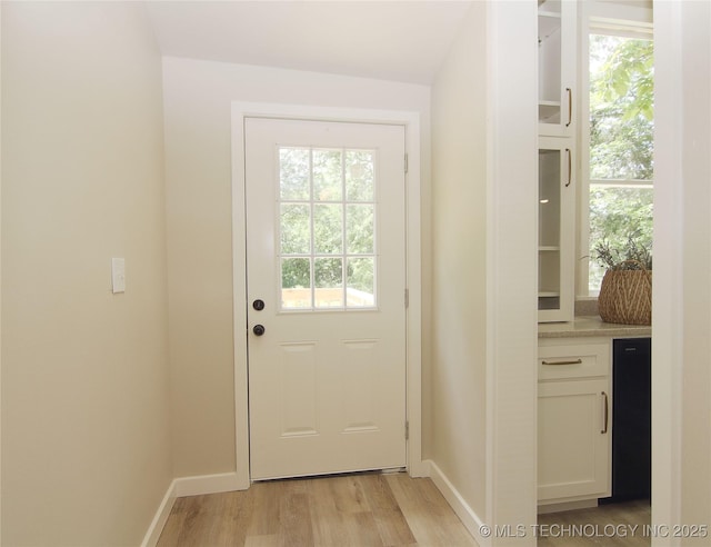 611 N State St, Wagoner, OK 74467 - entryway featuring light wood-style flooring and baseboards