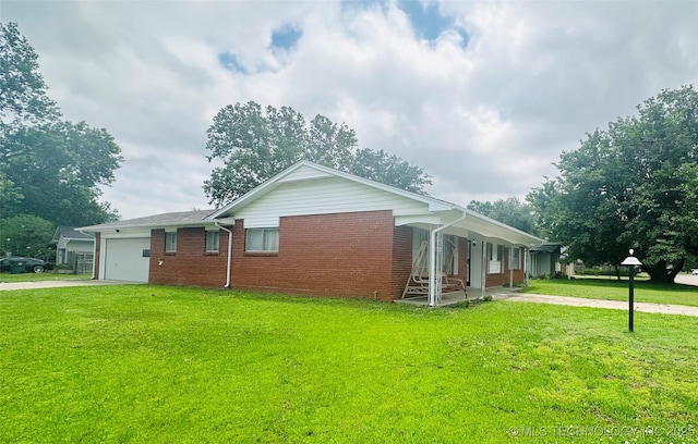 3405 S 85th E Ave, Tulsa, OK 74145 - view of home's exterior with driveway, a garage, a lawn, and brick siding