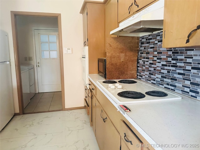 3405 S 85th E Ave, Tulsa, OK 74145 - kitchen with under cabinet range hood, light countertops, white appliances, and decorative backsplash