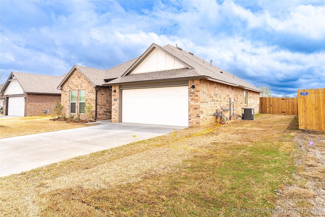 27790 E 109th Pl S, Coweta, OK 74429 - single story home with an attached garage, brick siding, a shingled roof, driveway, and cooling unit