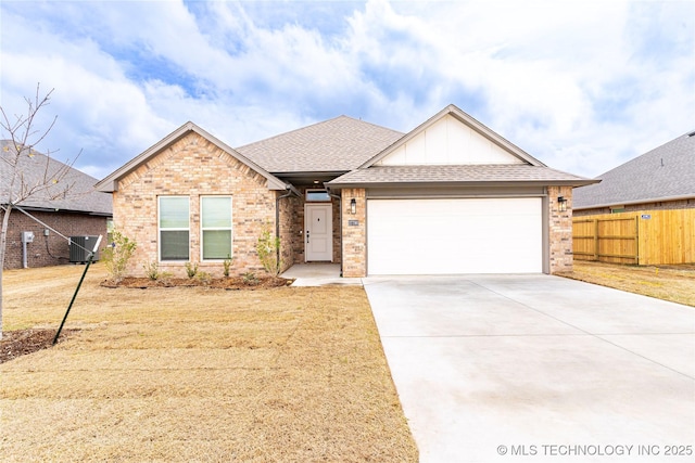 27790 E 109th Pl S, Coweta, OK 74429 - view of front facade with a garage, brick siding, driveway, and central AC