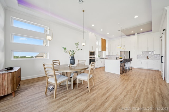 2357 E 134th Cir, Bixby, OK 74008 - dining space featuring healthy amount of natural light, light wood-type flooring, recessed lighting, and crown molding