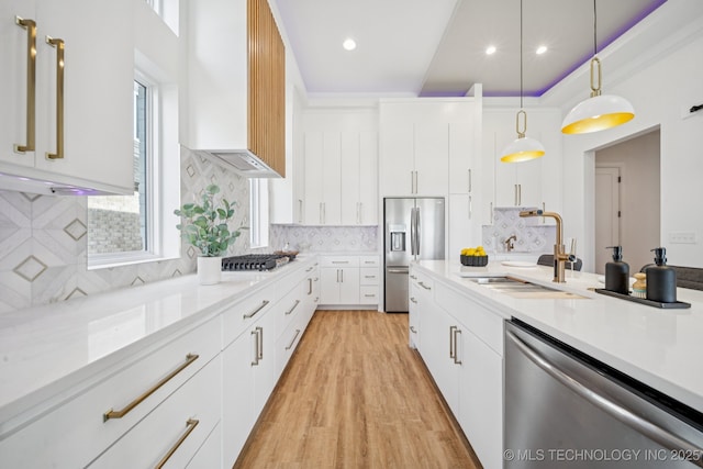 2357 E 134th Cir, Bixby, OK 74008 - kitchen featuring stainless steel appliances, custom range hood, light countertops, hanging light fixtures, and white cabinetry