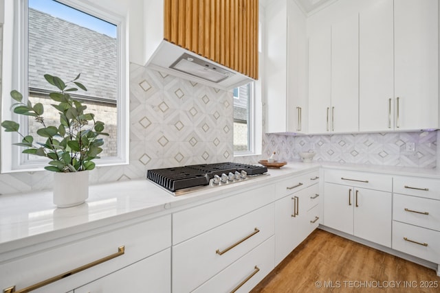 2357 E 134th Cir, Bixby, OK 74008 - kitchen with stainless steel gas stovetop, decorative backsplash, and plenty of natural light