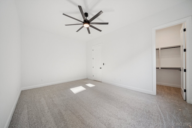 2357 E 134th Cir, Bixby, OK 74008 - unfurnished bedroom with carpet, a spacious closet, and ceiling fan