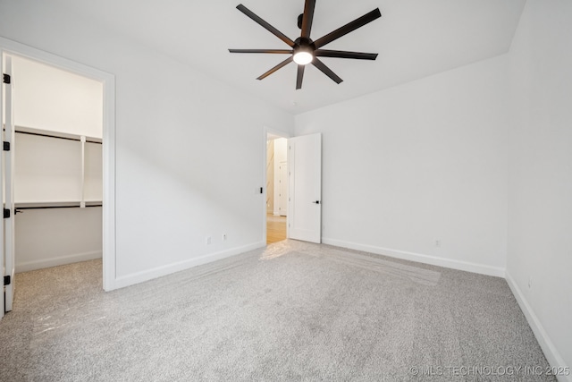 2357 E 134th Cir, Bixby, OK 74008 - unfurnished bedroom featuring carpet floors, a spacious closet, ceiling fan, and a closet
