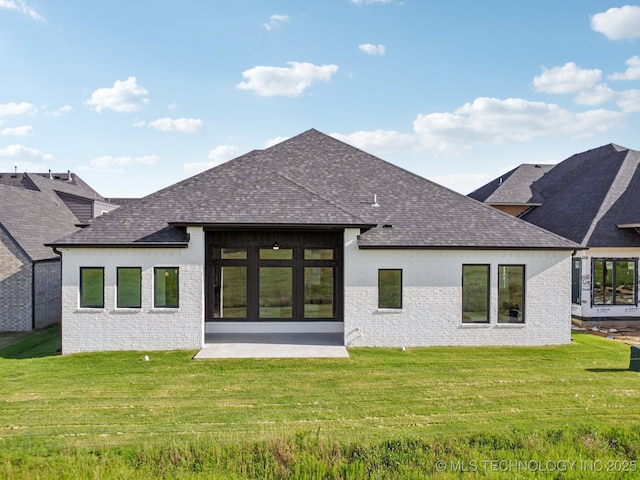 2357 E 134th Cir, Bixby, OK 74008 - rear view of property with roof with shingles, a yard, and brick siding