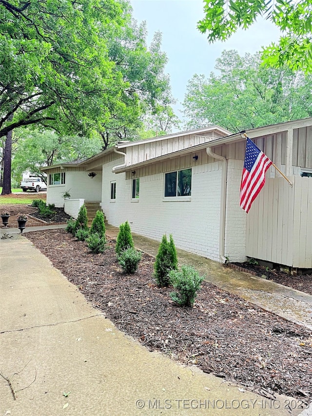 2232 Gershwin Dr, Durant, OK 74701 - view of side of home featuring brick siding