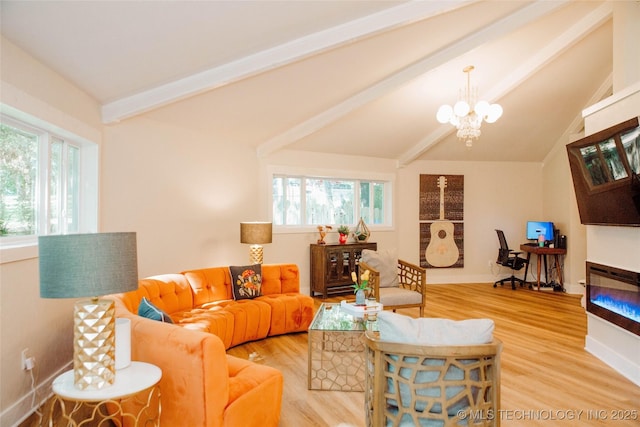 2232 Gershwin Dr, Durant, OK 74701 - living room with healthy amount of natural light, light wood-style floors, a chandelier, and a glass covered fireplace