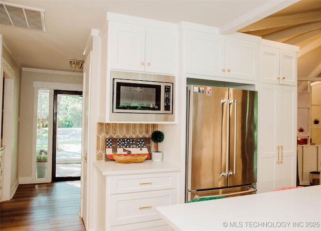 2232 Gershwin Dr, Durant, OK 74701 - kitchen featuring stainless steel appliances, white cabinetry, light countertops, and ornamental molding