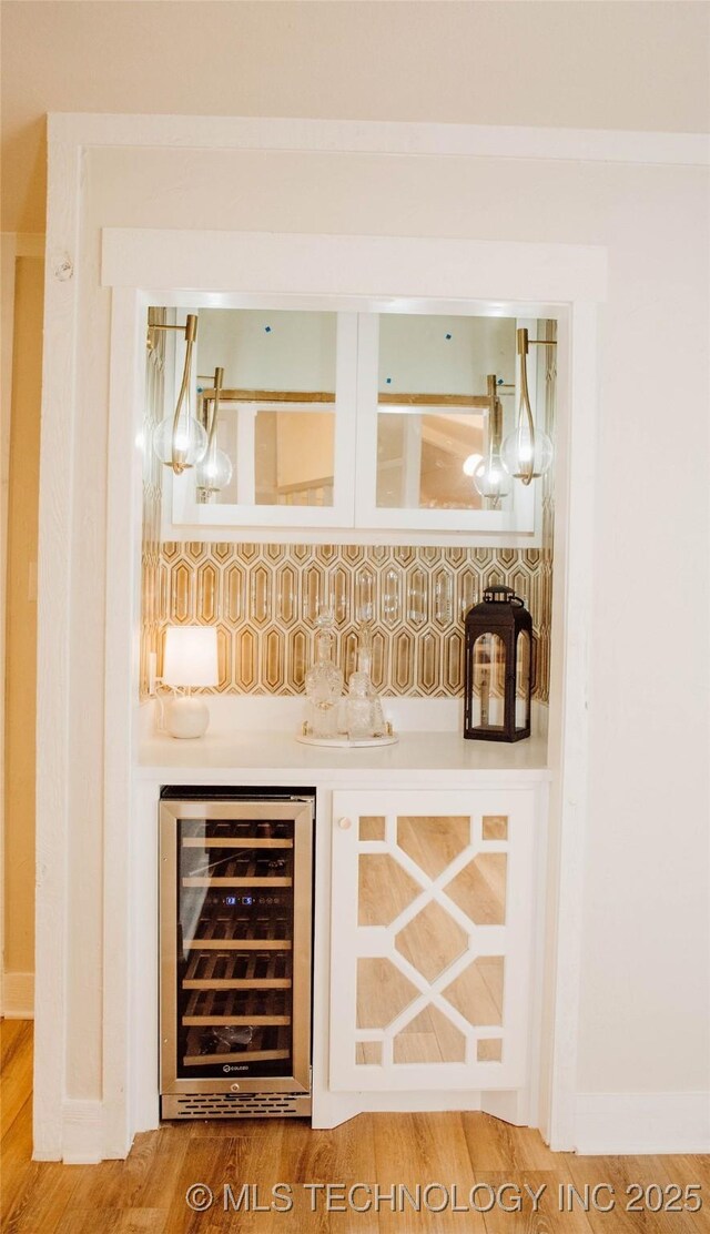 2232 Gershwin Dr, Durant, OK 74701 - indoor bar featuring wine cooler and wood finished floors