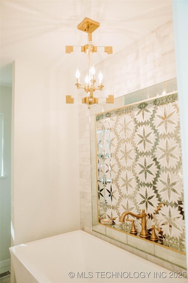 2232 Gershwin Dr, Durant, OK 74701 - bathroom featuring a chandelier and a tub to relax in