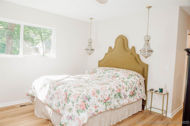 2232 Gershwin Dr, Durant, OK 74701 - bedroom with wood finished floors and baseboards