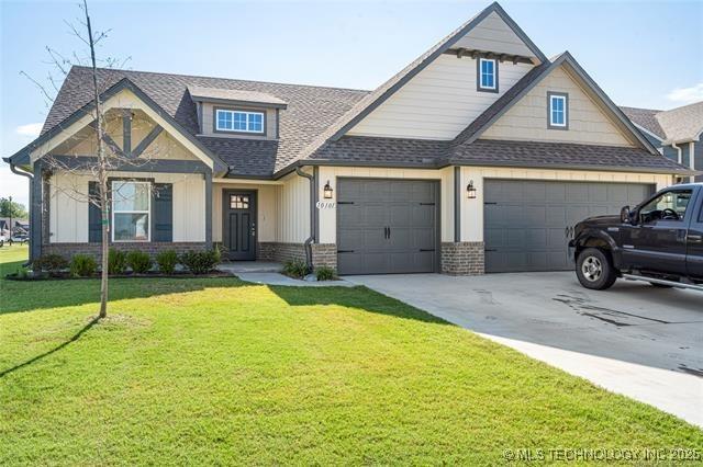 10101 S 232nd E Ave, Broken Arrow, OK 74014 - view of front facade featuring brick siding, roof with shingles, driveway, a front lawn, and an attached garage