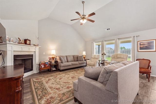 10101 S 232nd E Ave, Broken Arrow, OK 74014 - living area featuring ceiling fan, vaulted ceiling, wood finished floors, and a fireplace