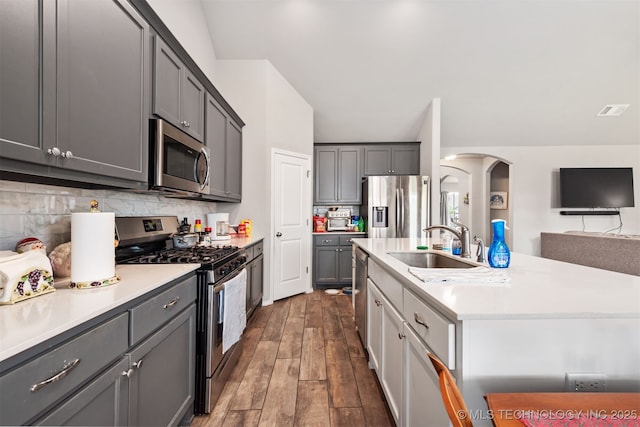 10101 S 232nd E Ave, Broken Arrow, OK 74014 - kitchen featuring stainless steel appliances, light countertops, gray cabinetry, and decorative backsplash