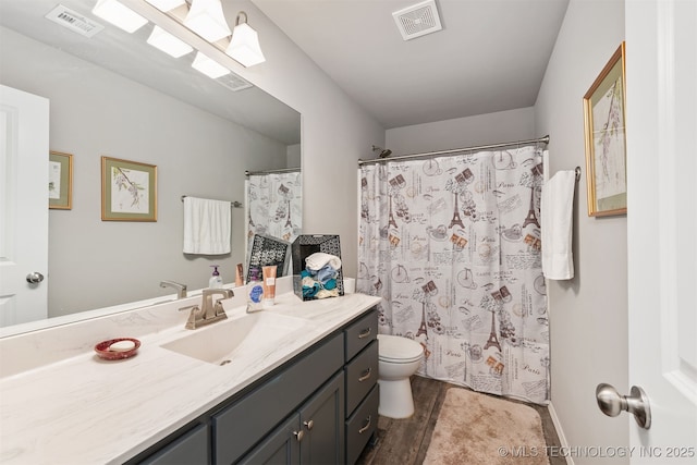 10101 S 232nd E Ave, Broken Arrow, OK 74014 - bathroom with vanity, wood finished floors, toilet, and curtained shower
