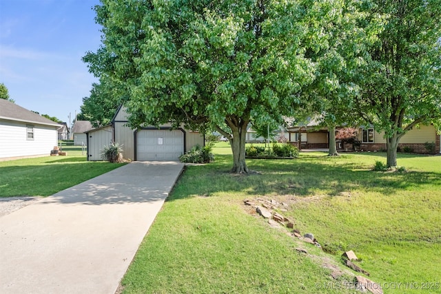 2101 S Buchanan Ave, Wagoner, OK 74467 - obstructed view of property with concrete driveway, a front lawn, an outbuilding, and a detached garage