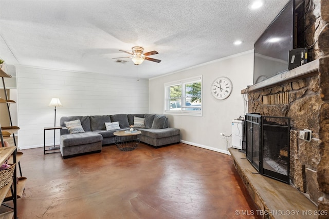 11200 E 112th St N, Owasso, OK 74055 - living room with a ceiling fan, baseboards, crown molding, finished concrete flooring, and a stone fireplace