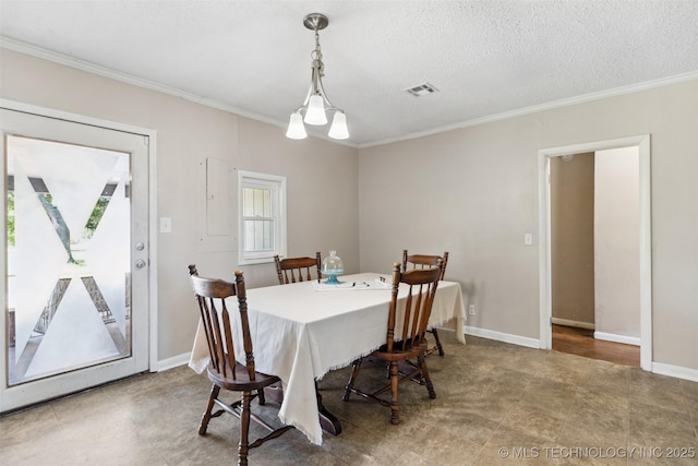 11200 E 112th St N, Owasso, OK 74055 - dining area with crown molding, baseboards, and a textured ceiling