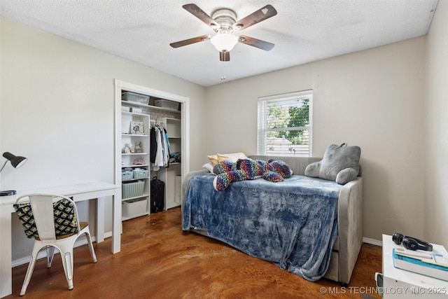 11200 E 112th St N, Owasso, OK 74055 - bedroom featuring finished concrete floors, a closet, a ceiling fan, a textured ceiling, and baseboards
