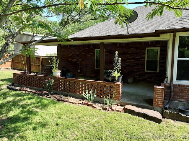 46 Acorn St, Eufaula, OK 74432 - back of house featuring brick siding and a shingled roof