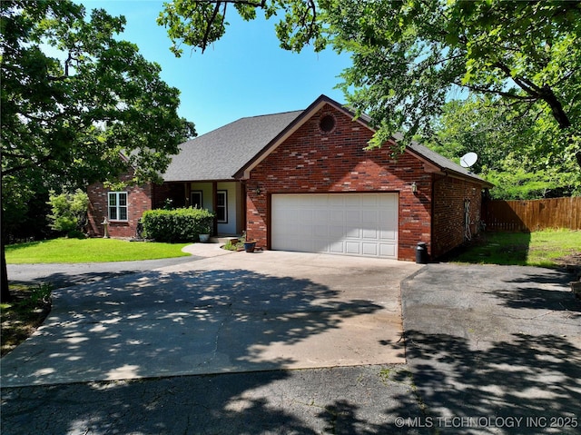 46 Acorn St, Eufaula, OK 74432 - traditional home featuring driveway, a garage, and brick siding