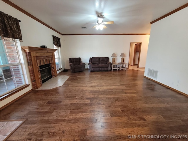 46 Acorn St, Eufaula, OK 74432 - living room featuring ceiling fan, ornamental molding, wood finished floors, and a brick fireplace