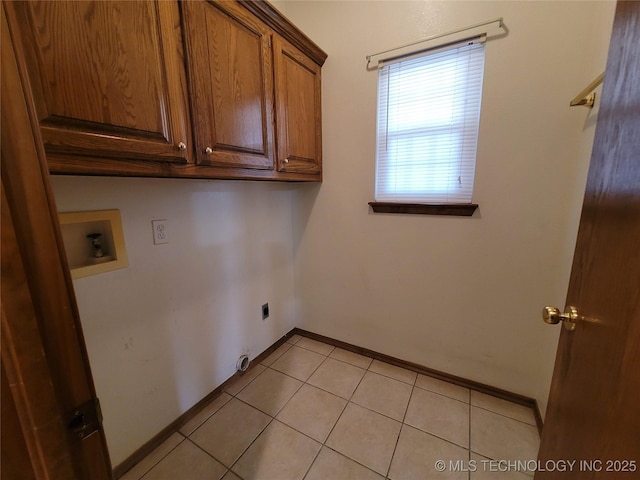46 Acorn St, Eufaula, OK 74432 - laundry room featuring cabinet space, washer hookup, electric dryer hookup, and light tile patterned floors