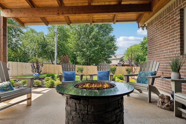 8906 E 110th St, Tulsa, OK 74133 - view of patio featuring a fire pit