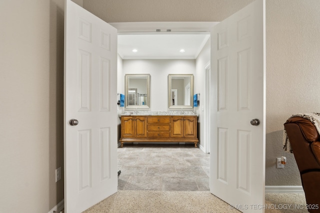 8906 E 110th St, Tulsa, OK 74133 - bathroom with double vanity, baseboards, ornamental molding, and recessed lighting