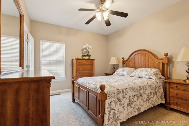 8906 E 110th St, Tulsa, OK 74133 - bedroom featuring light colored carpet, baseboards, and a ceiling fan