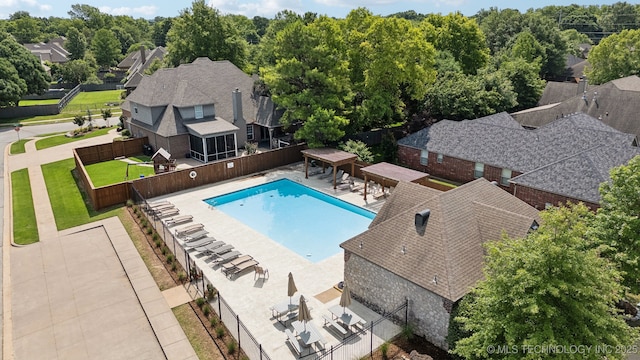 8906 E 110th St, Tulsa, OK 74133 - view of swimming pool featuring a patio area and a residential view