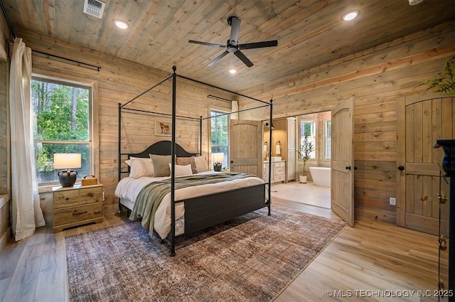 475 Bear Pine Trl, Broken Bow, OK 74728 - bedroom featuring wooden ceiling, wood walls, multiple windows, light wood finished floors, and recessed lighting