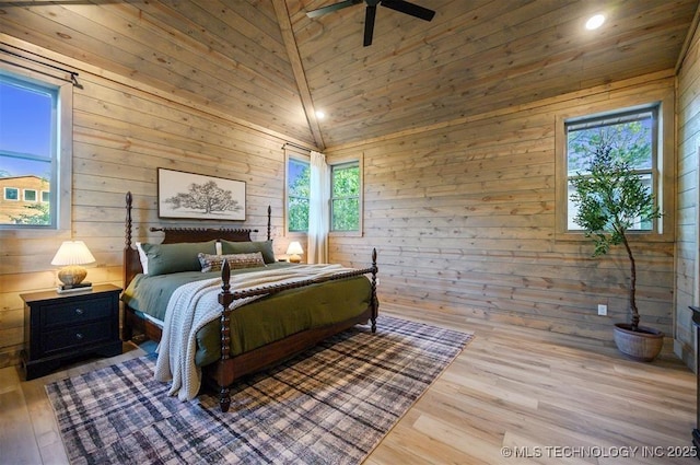 475 Bear Pine Trl, Broken Bow, OK 74728 - bedroom featuring wooden walls, multiple windows, wood finished floors, and recessed lighting