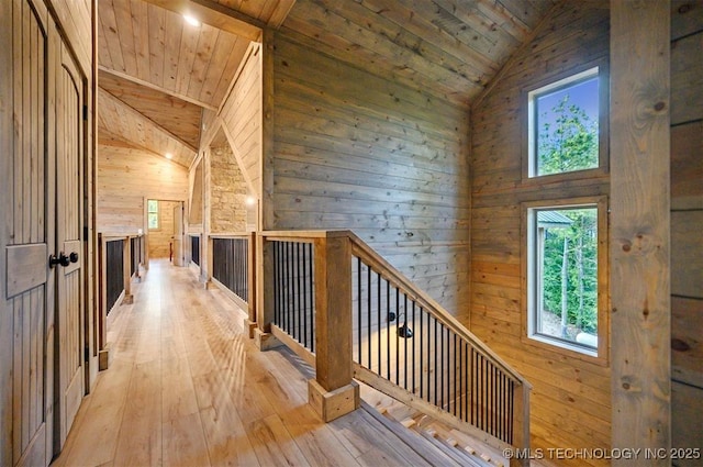 475 Bear Pine Trl, Broken Bow, OK 74728 - hallway featuring wooden ceiling, vaulted ceiling, an upstairs landing, wood-type flooring, and wooden walls