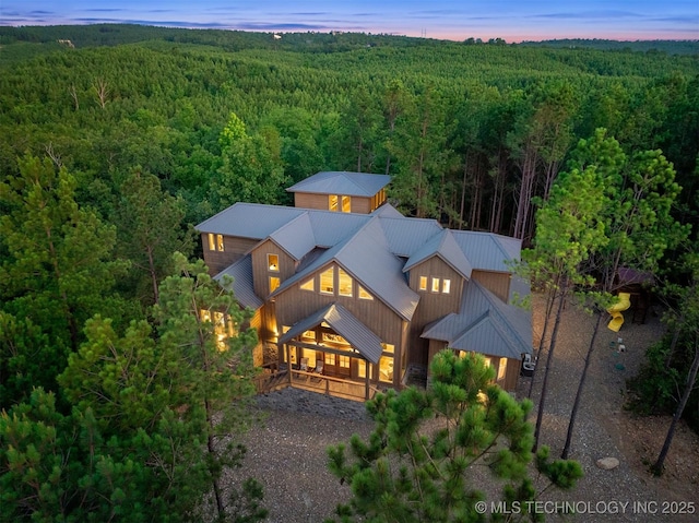 475 Bear Pine Trl, Broken Bow, OK 74728 - back of house featuring a forest view and a metal roof