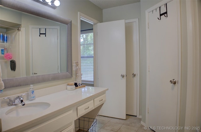 13866 S Nyssa Pl, Glenpool, OK 74033 - bathroom featuring vanity, tile patterned flooring, and curtained shower