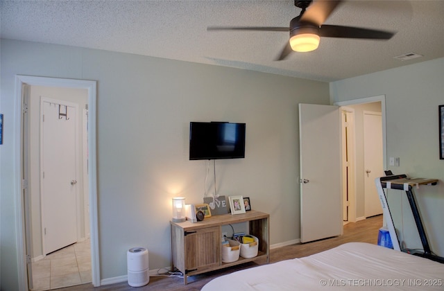 13866 S Nyssa Pl, Glenpool, OK 74033 - bedroom featuring a textured ceiling and a ceiling fan