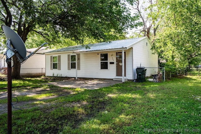 420 E Elm St, Skiatook, OK 74070 - ranch-style home featuring metal roof and a patio area